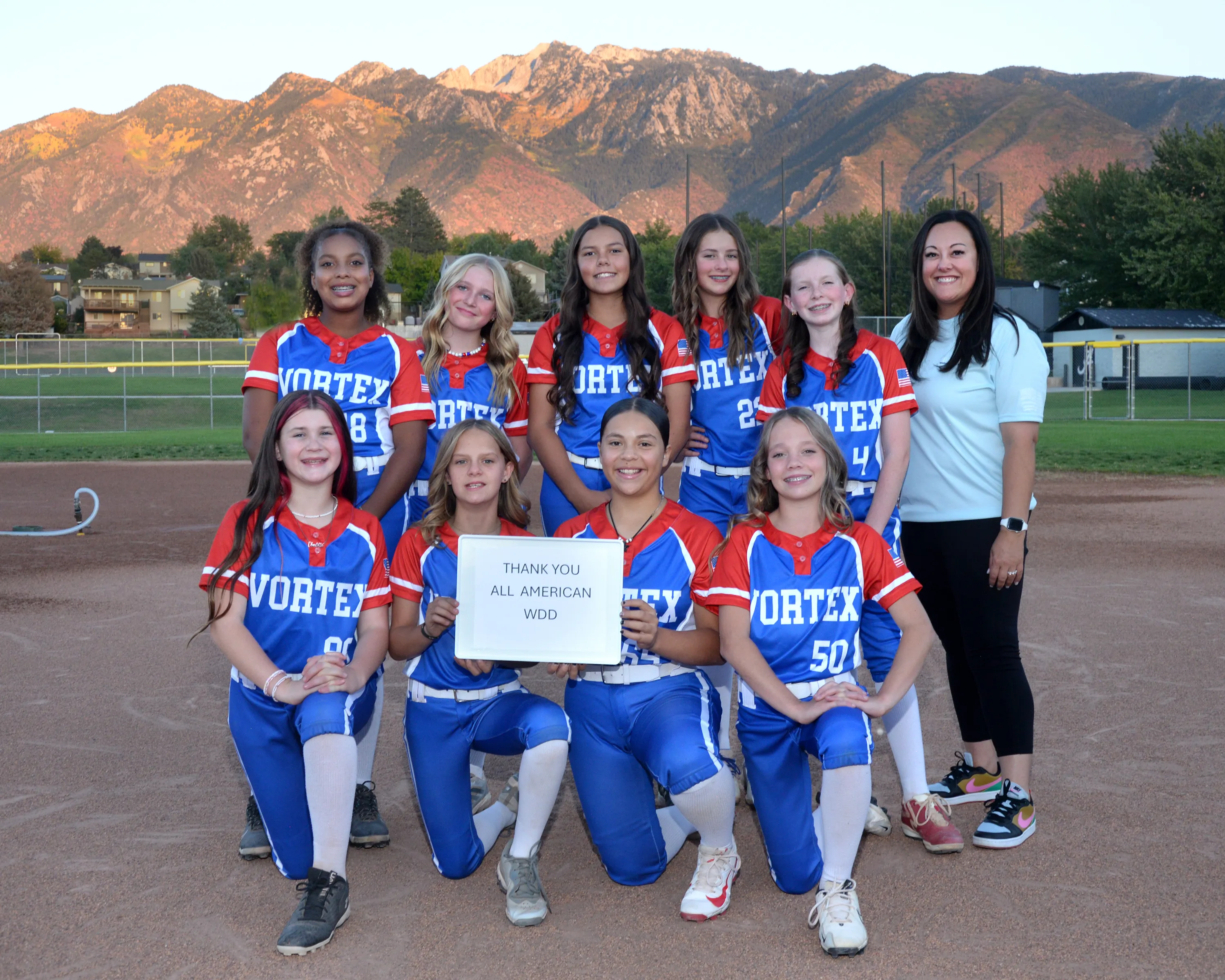 Youth softball team sponsored by All American Windows, Doors & Decks